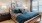 a bed with a blue comforter