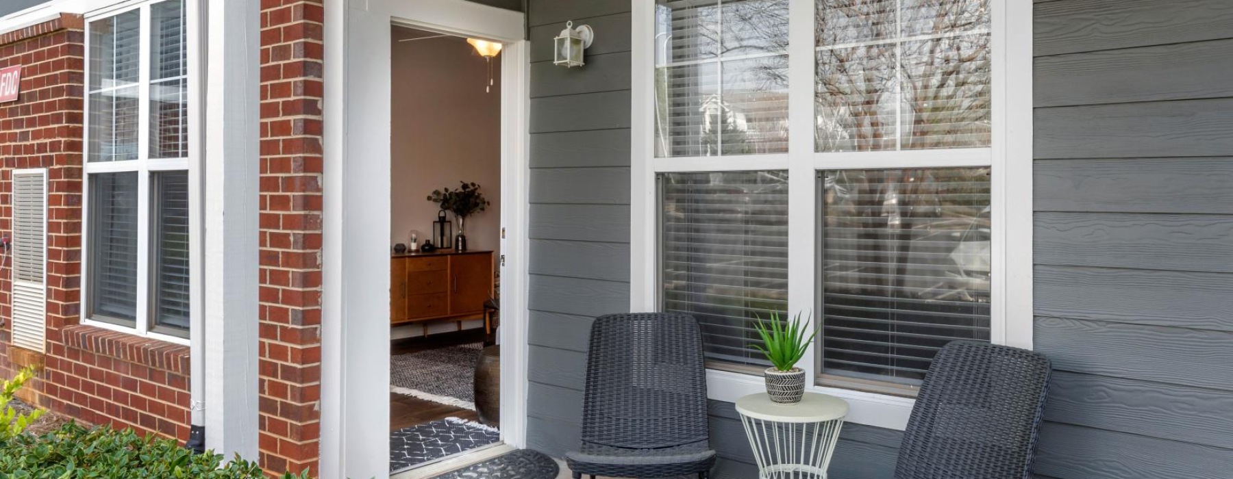 a patio with chairs and a table