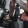 hands grabbing dumbbells from a weight rack