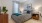 a bedroom with a bed and lamps