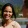 a woman smiling at another